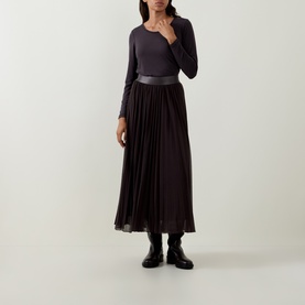 Model wearing Tuzzi Dark Chocolate long-sleeve fitted shirt, styled with pleated midi skirt, leather belt and black ankle boots
