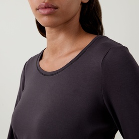 Model wearing Tuzzi Dark Chocolate long-sleeve crew-neck shirt in stretch viscose, close-up detail view.