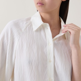 Model wearing Marc O Polo Textured Drawstring Blouse in white with crinkle finish, kent collar, and front button fastening visible at neckline