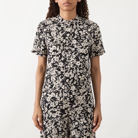 Model wearing Marc O Polo Floral Fluid Blouse in black multi, short sleeves, standing collar, allover floral print, styled with matching wide-leg