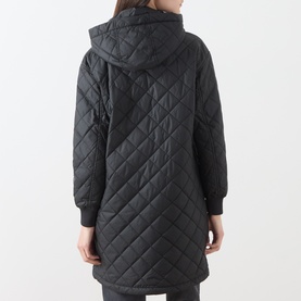 Model wearing Marc O Polo black quilted hooded coat, rear view, showing diamond quilting pattern and ribbed cuffs