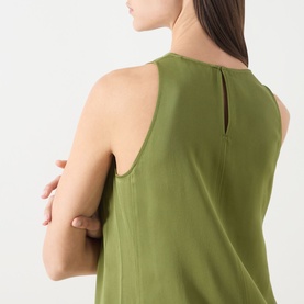 Model wearing Marc O Polo Dress in Shaded Fern, sleeveless style with keyhole back detail, 100% viscose fabric.
