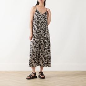 Model wearing Marc O Polo black multi floral print midi slip dress in viscose, styled with black chunky sandals
