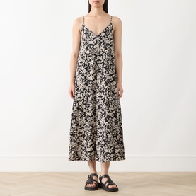 Model wearing Marc O Polo black multi floral print midi dress with thin straps, styled with black chunky sandals