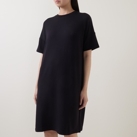 Model wearing Marc O Polo Solid Sweatshirt Dress in black, round neck, dropped shoulders, short sleeves, straight mini-length silhouette