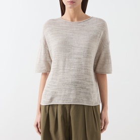 Model wearing Marc O Polo linen beige knit top with elbow-length sleeves and relaxed fit, styled with olive wide-leg trousers.