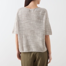Model wearing Marc O Polo Linen Beige knit top, back view, short sleeves, relaxed fit, styled with olive trousers