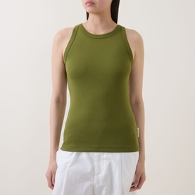 Model wearing Marc O Polo Solid Logo Tank Top in Shaded Fern, round neckline, wide straps, styled with white trousers
