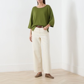 Model wearing Marc O Polo Shaded Fern cotton T-shirt with wide sleeves, styled with cream wide-leg trousers and a brown belt.