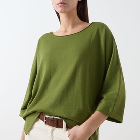 Model wearing Marc O Polo Shaded Fern cotton T-shirt with batwing sleeves, styled with cream trousers and a brown leather belt.