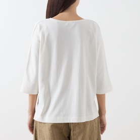 Model wearing Marc O Polo White Cotton T-Shirt, back view, three-quarter sleeves, relaxed fit, styled with khaki wide-leg trousers