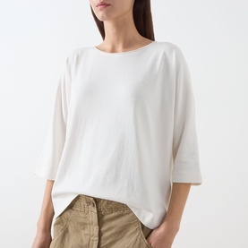 Model wearing Marc O Polo White Cotton T-Shirt in relaxed fit with cropped sleeves, styled with khaki trousers