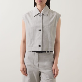 Model wearing Marc O Polo Linen Beige sleeveless cropped vest with collar and button front, styled with matching wide-leg trousers