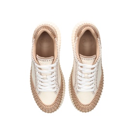 Overhead view of cream and beige leather lace-up trainers with chunky ridged platform sole and contrast stitching detail