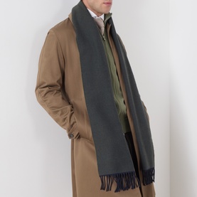 Model with Eton Logo Twill Fringe Scarf in dark green wool with fringed ends, styled over tan overcoat and green jacket.