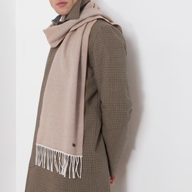Model with Eton Logo Twill Fringe Scarf in beige, featuring fringed ends and logo plaque, styled over a houndstooth coat