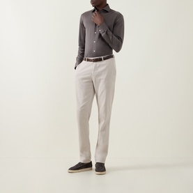 Model wearing Eton Fid De Scozia Single-Cuff Shirt in dark brown, styled with stone chinos, brown belt and navy suede loafers