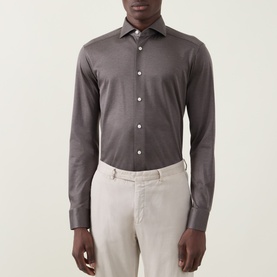Model wearing Eton Fid De Scozia Single-Cuff Shirt in dark brown, pointed collar, long sleeves, button front, styled with light beige trousers