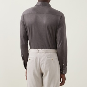 Model wearing Eton Fid De Scozia Single-Cuff Shirt in dark brown, rear view, with light grey trousers