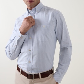 Model wearing Eton mid blue stripe cotton casual shirt with button-down collar and chest pocket, styled with beige chinos and brown belt