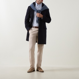 Model wearing Eton Mid Blue casual cotton shirt, styled with navy overcoat, light blue scarf, stone trousers and tan suede loafers