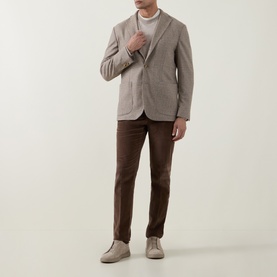 Model wearing Eton beige jacket with white crew-neck tee, brown trousers and light suede desert boots