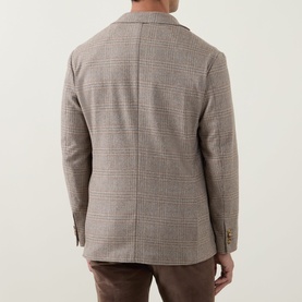 Model wearing Eton beige houndstooth check blazer, back view, styled with brown trousers
