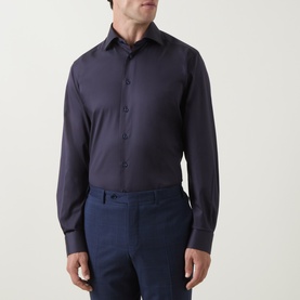 Model wearing Eton Navy Geo Trim Single Cuff Regular shirt in navy, styled with navy trousers.