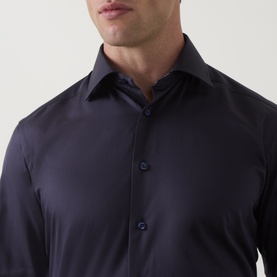 Model wearing Eton Navy Geo Trim Single Cuff Regular shirt, close-up showing spread collar and button placket detail