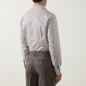 Model wearing Eton brown gingham check cotton formal shirt, single cuff regular fit, styled with grey tailored trousers. Rear view.