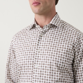Model wearing Eton Single Cuff Regular shirt in brown geometric medallion print, 100% cotton, close-up of collar and chest detail