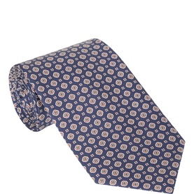 Eton Medallion Silk Tie in navy blue with repeating geometric medallion print, pointed tip, and wide blade