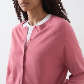 Model wearing Marc O Polo Berry Rose wool cardigan with button front, styled with a white collared shirt underneath.