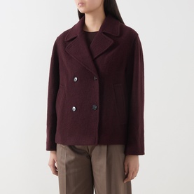 Model wearing Marc O Polo Black Cherry wool jacket, double-breasted with wide lapels, styled with taupe trousers