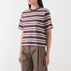 Model wearing Marc O Polo Dark Red Multi striped cotton T-shirt with crew neck and short sleeves, styled with taupe wide-leg trousers