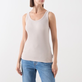 Model wearing Marc O Polo Natural ribbed sleeveless vest top, styled with blue jeans