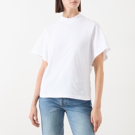 Model wearing Marc O Polo white cotton T-shirt with mock neck and short flutter sleeves, styled with blue jeans.