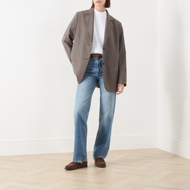 Model wearing Marc O Polo white cotton T-shirt, styled with taupe oversized blazer, light blue straight-leg jeans, and brown loafers.
