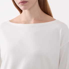 Model wearing Marc O Polo White Cotton T-shirt with bateau neckline and long sleeves, relaxed fit in modal-cotton blend.