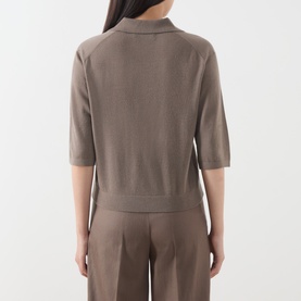 Model wearing Marc O Polo Stone Taupe wool knit top, back view, with matching wide-leg trousers