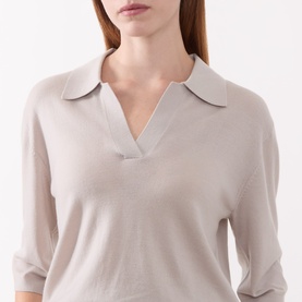 Model wearing Marc O Polo natural knit top with open polo collar and three-quarter length sleeves, close-up detail view