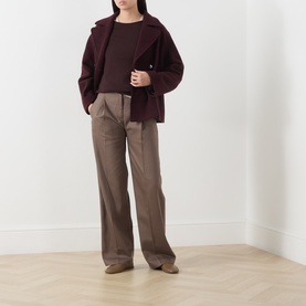 Model wearing Marc O Polo Stone Taupe wide-leg trousers with a burgundy knit top and matching oversized jacket.