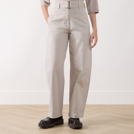 Model wearing Marc O Polo natural wide-leg belted trousers in cotton-lyocell blend, styled with a grey top and black chunky loafers.