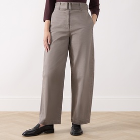 Model wearing Marc O Polo Stone Taupe wide-leg belted trousers, styled with a burgundy top and black loafers.