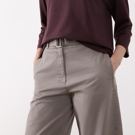 Model wearing Marc O Polo Stone Taupe wide-leg trousers with silver belt, styled with a burgundy long-sleeve top.