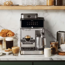 Ninja AutoBarista Pro Coffee Machine in stainless steel, styled on marble kitchen counter with espresso, iced coffee, and pastries