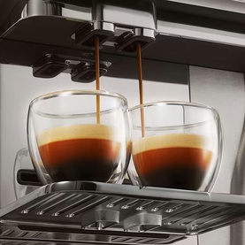 Ninja AutoBarista Pro Coffee Machine brewing espresso into two double-walled glass cups on stainless steel drip tray