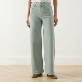 Model wearing Paige Wide Leg Jeans in Vintage Seaglass, high-rise with wide-leg silhouette in soft green denim fabric