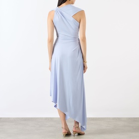 Model wearing Victoria Beckham Cloud Blue asymmetric midi dress with draped back detail and cutout, shown from behind, styled with nude heels.