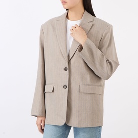 Model wearing Anine Bing linen-blend blazer in neutral multi, two-button fastening, flap pockets, styled with white top.